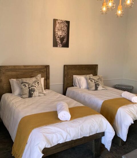 single beds in room of claassens safaris