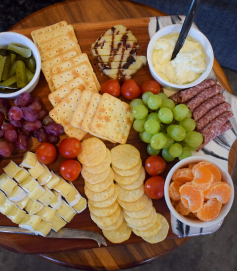 fruit, cheese, crackers and dip on table