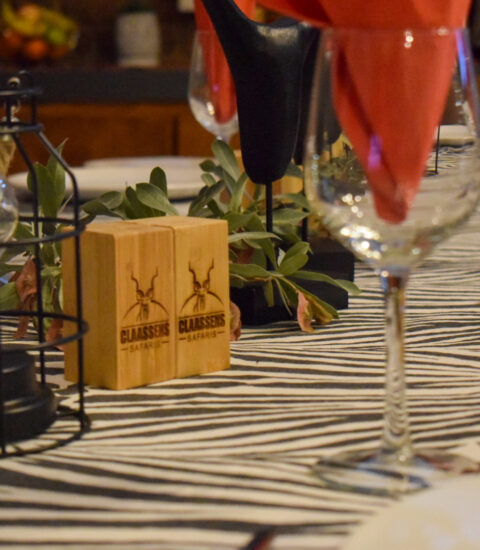 close up of table decorations, table lamp and wine glasses