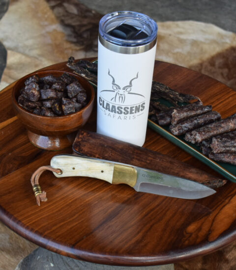 gallery illustrates droewors/biltong and a knife on a small round table at Claassens Safaris